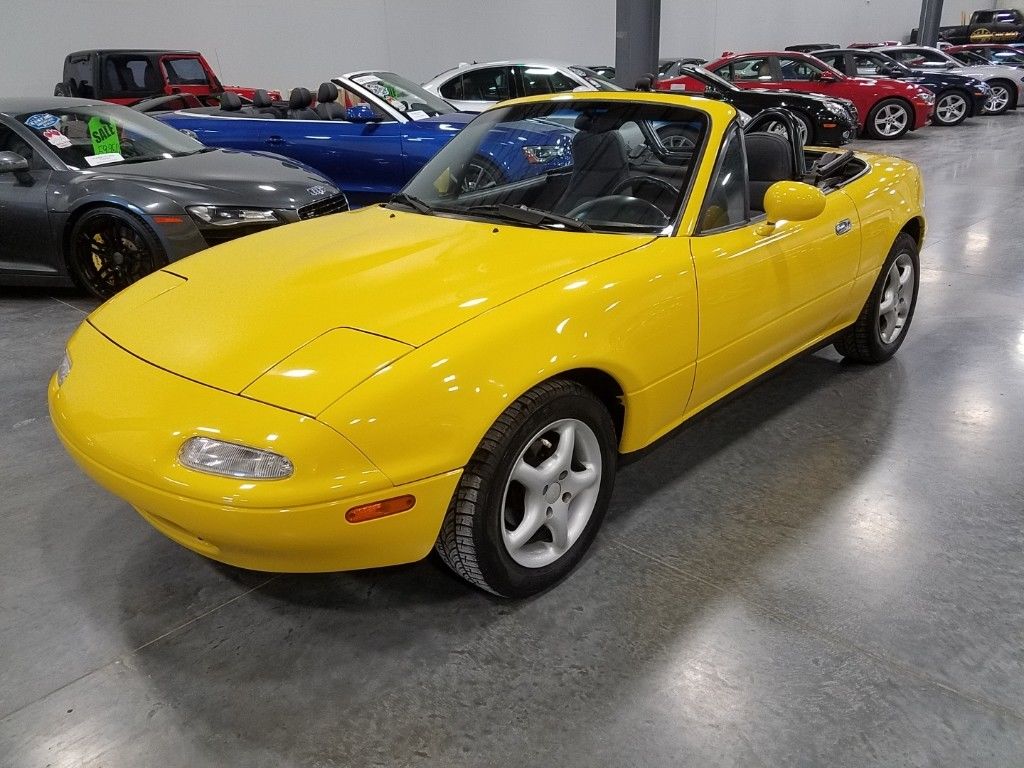 Yellow Mazda MX5 Miata Parked