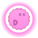 D-ScratchNinja's profile picture, a pink shape resembling a square with bumps on the edges, similar to a wavy circle, with a letter D on the bottom left corner and eyes looking ahead on the top right corner, all inside a pink circular ring