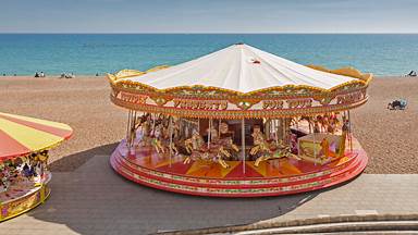 Golden Gallopers Carousel on the seafront in Brighton, East Sussex, England (© Graham Prentice/Alamy)