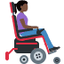 Woman in motorized wheelchair facing right: dark skin tone