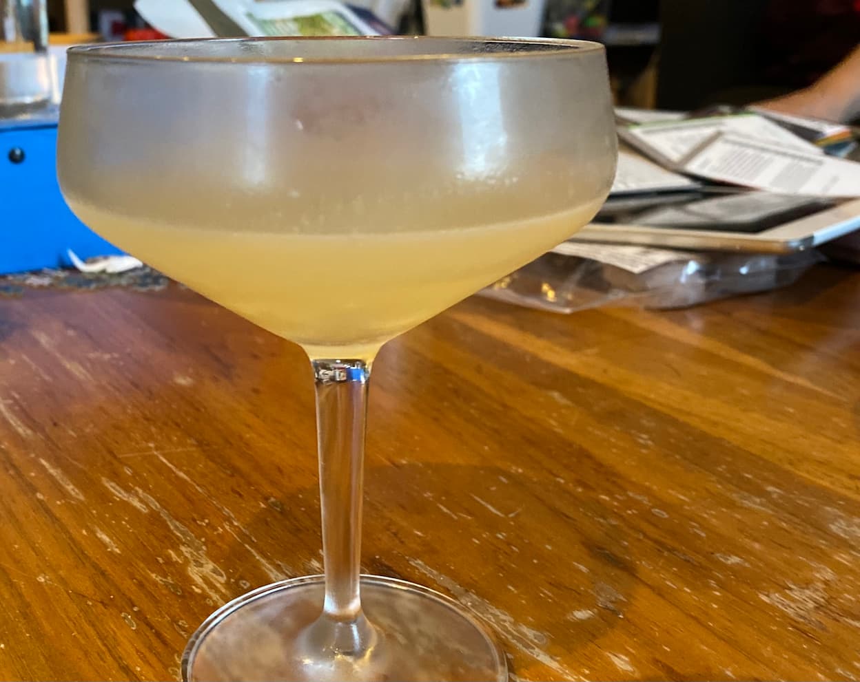 A tasty looking margarita in a moderately fancy cocktail glass