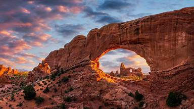 Evening light over North Window with Turret Arch in the distance, Arches National Park, Utah (© Anthony Heflin/Shutterstock)
