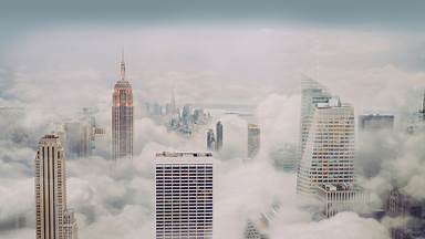 New York City skyline in fog (© Orbon Alija/Getty Images)