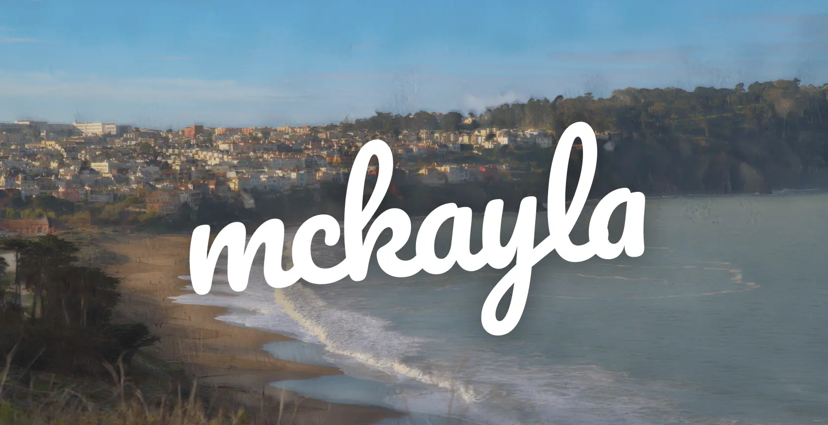 My name, McKayla, over a south-facing photograph of the San Francisco coast that I took