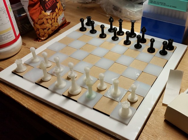 Image of 3d printed pieces, laser cut board