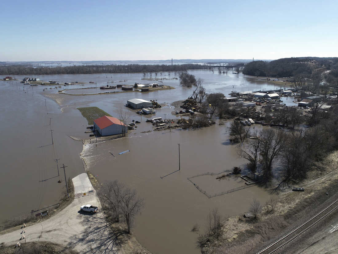 Inland floods in the Midwest - houses partially submerged in brown water