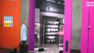 dummy walks into poster of a store