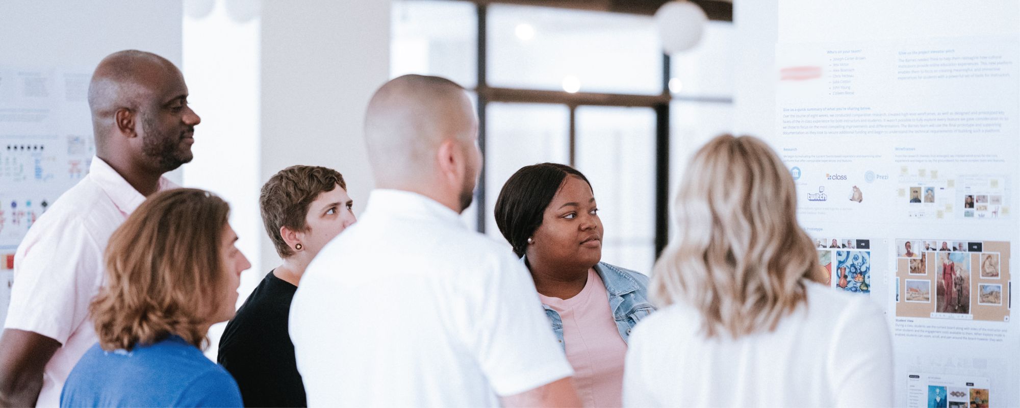 A group of Thinkers looking at a whiteboard