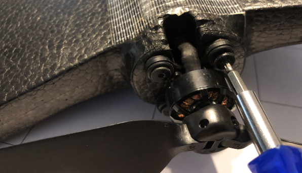 Removing lower motor mount screws