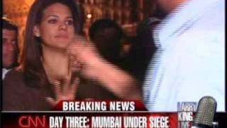 CNN reporter Sara Sidner is surrounded by an angry crowd in Mumbai