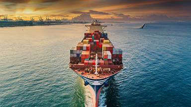 Container ship near a commercial port in Thailand (© Suriyapong Thongsawang/Getty Images)