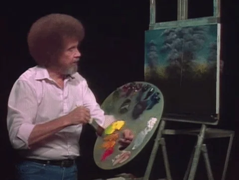 Bob Ross mixing colors together using his palette