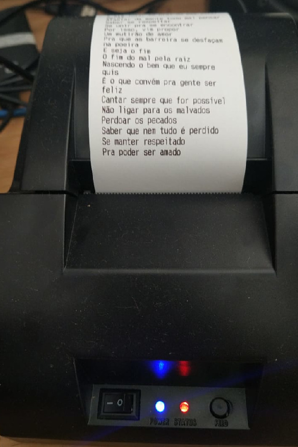 Picture of POS-5890C thermal printer with printed poem