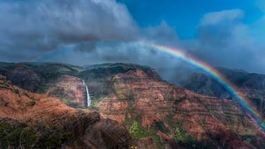 Rainbow over Waimea Canyon and Waipo'o Falls, Kauai, Hawaii (© Beverley Van Praagh/Getty Images)