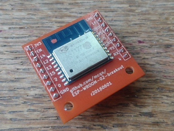 Picture of the ESP-WROOM-02 Breakout Board my mcqn A small red silk screened component with an ESP Wifi chip on board and 2 sets of input and output pins