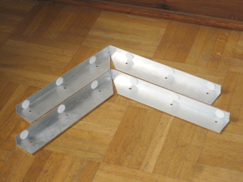 two aluminium brackets fitted with felt pads