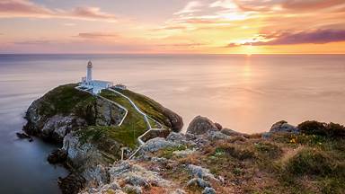 South Stack Lighthouse at sunset, Holy Island, Wales (© mariotlr/Getty Images)