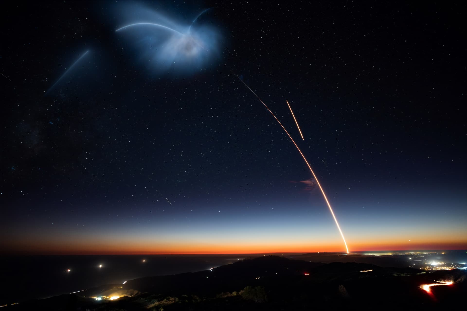 a launching rocket in the night sky