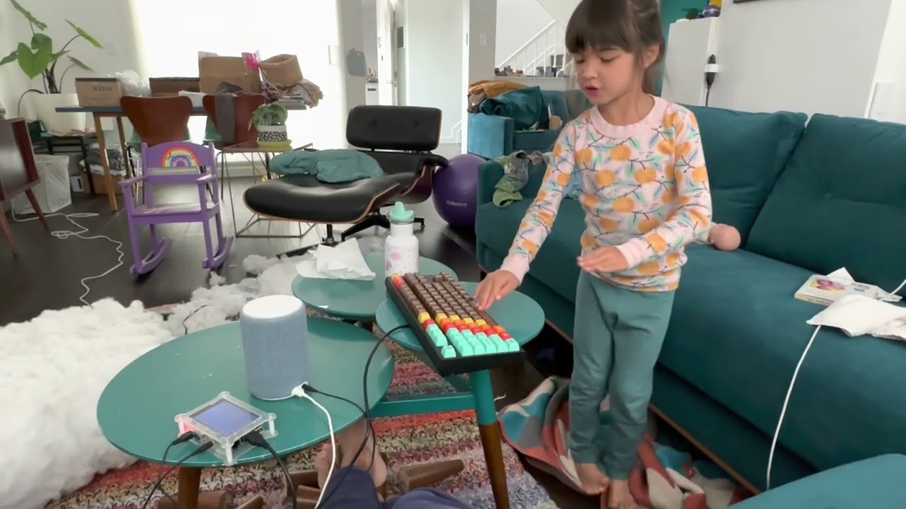 video of kid playing soundboard