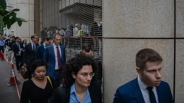 Foreign diplomats queue outside the West Kowloon Magistrates' Courts during a verdict for 47 pro-democracy activists in Hong Kong, China, 30 May 2024. A court in Hong Kong on 30 May convicted 14 defendants over 'conspiracy to subvert the state power' under the national security law, while two were acquitted, in trial of 47 prominent pro-democracy divs in Hong Kong arrested and charged in 2021.