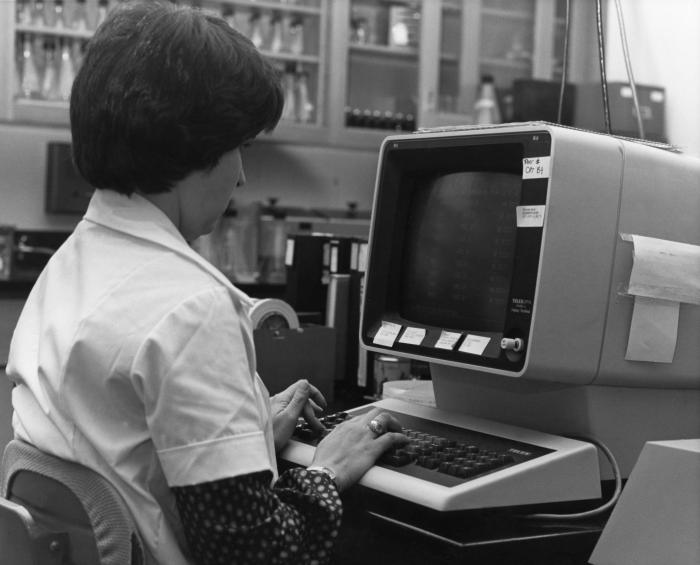  This 1980s photograph, taken within a Centers for Disease Control influenza testing laboratory, showed a laboratorian entering data into an influenza-specific database while seated at a computer workstation.