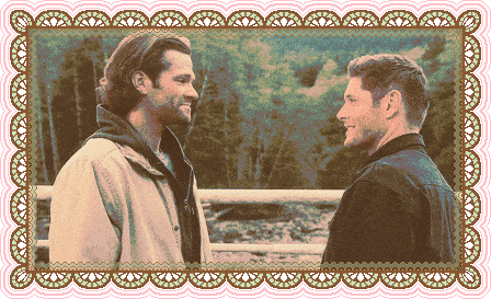 Jared Padalecki as Sam Winchester and Jensen Ackles as Dean Winchester standing in the dark, in front of a window, turning to look towards the camera