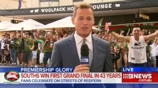 Rabbitohs fan flashes during Channel Nine News live cross