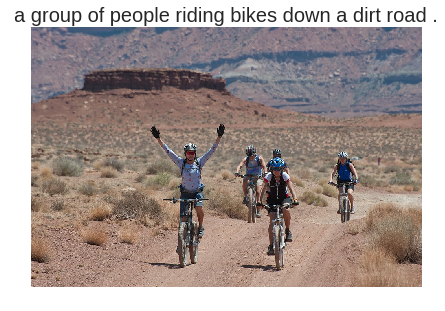 a group of people riding bikes down a dirt road