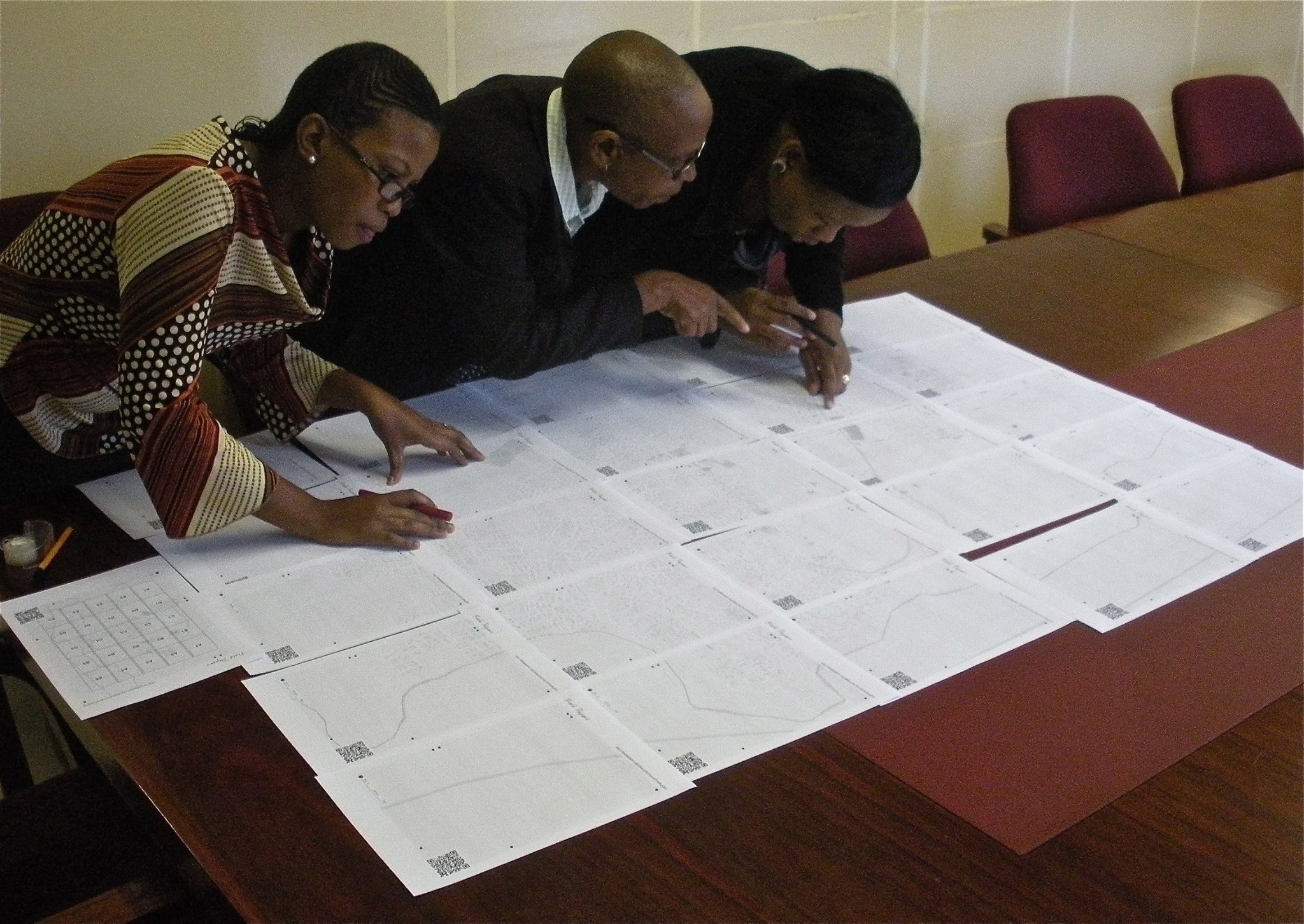 Colleagues of a Peace Corps Volunteer in Botswana participate in a community mapping exercise using Field Papers.