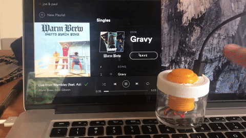 button in glass jar pauses music on computer.