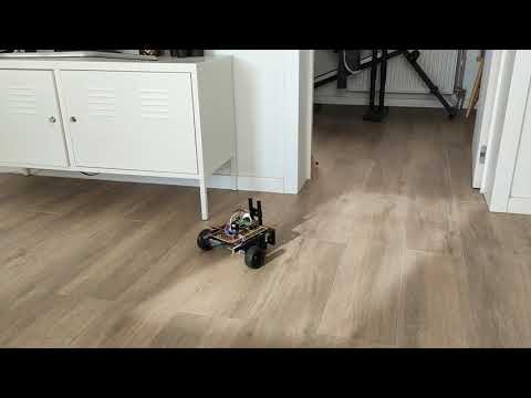 A remote car's prototype on the floor in a room