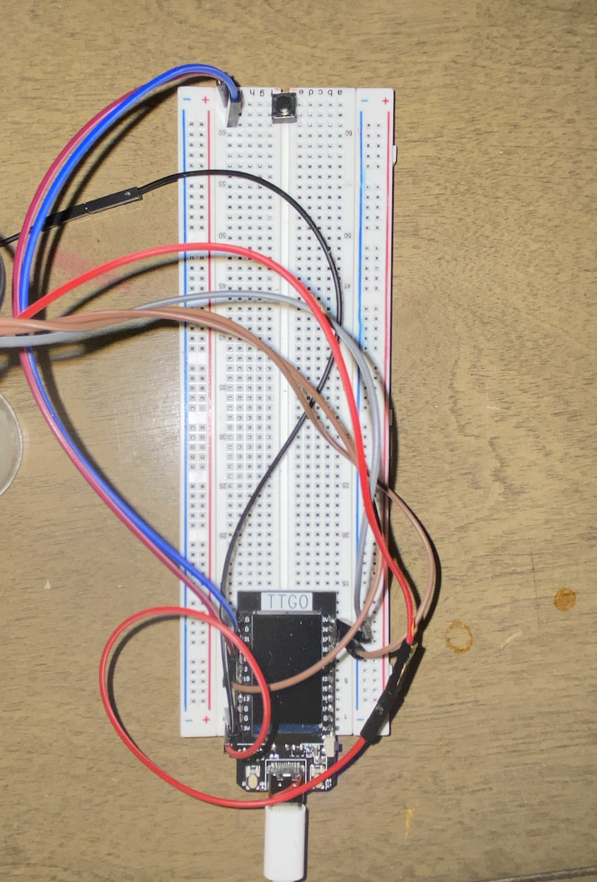 Breadboard with pins on the ESP-32 connected to joystick and button by male-to-female wires