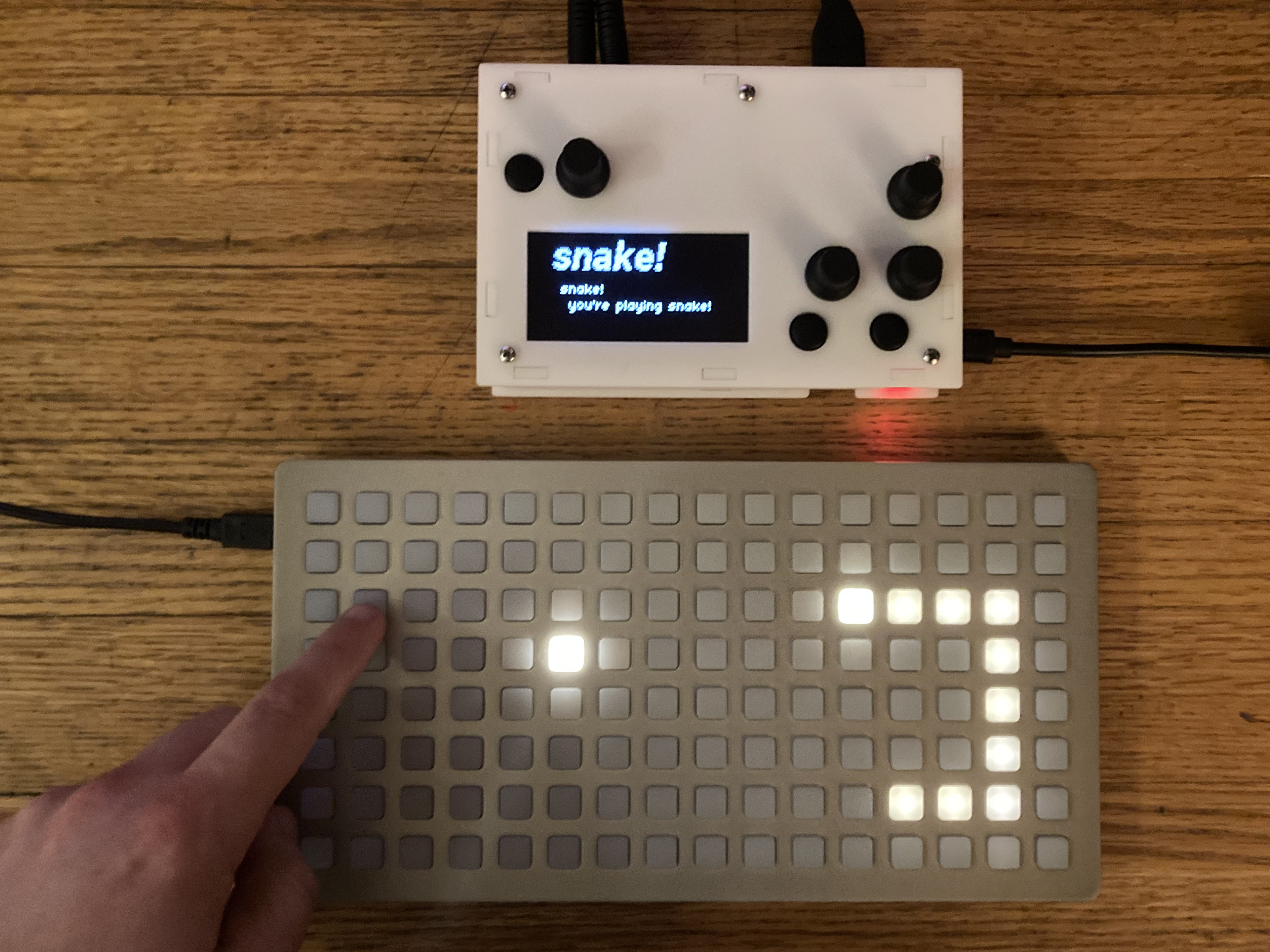 a picture of a monome norns and grid running this sequencer