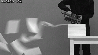 GIF of person using belt-sander on pile of papers
