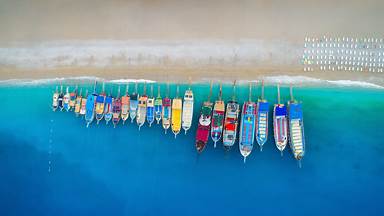 Aerial view of colorful boats in the Mediterranean Sea in Ölüdeniz, Turkey (© den-belitsky/Getty Images)