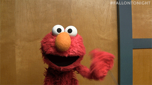Elmo, from Sesame Street, waving his hand