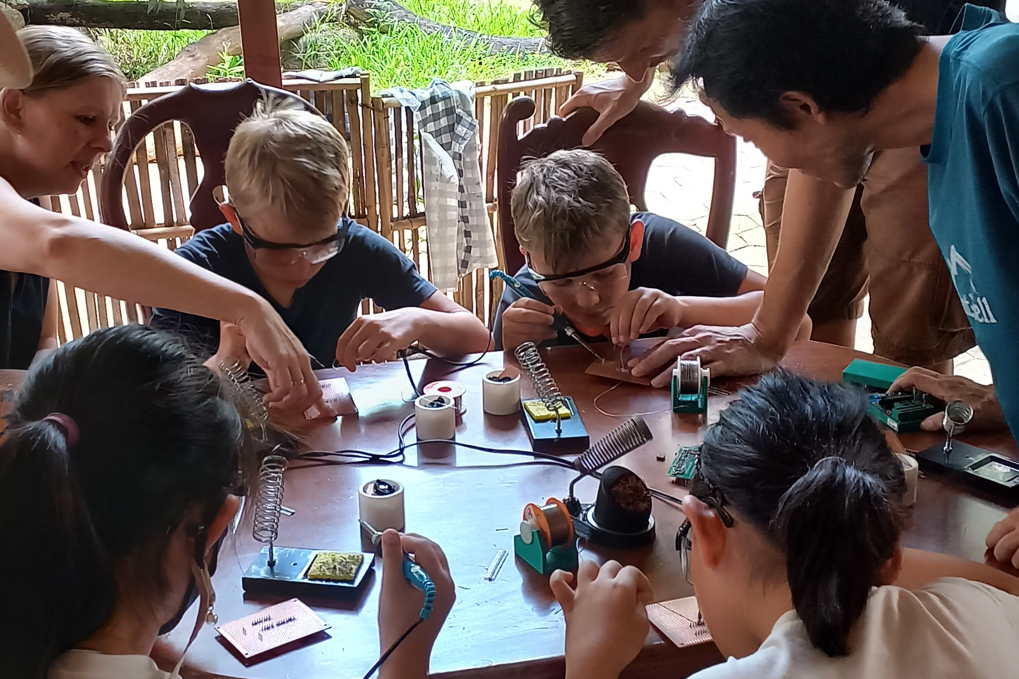 Children is learning soldering