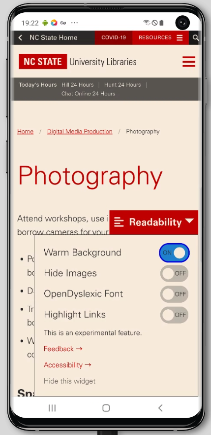 Readability widget menu opened with features, warm background turned on, giving the page a light orange cast