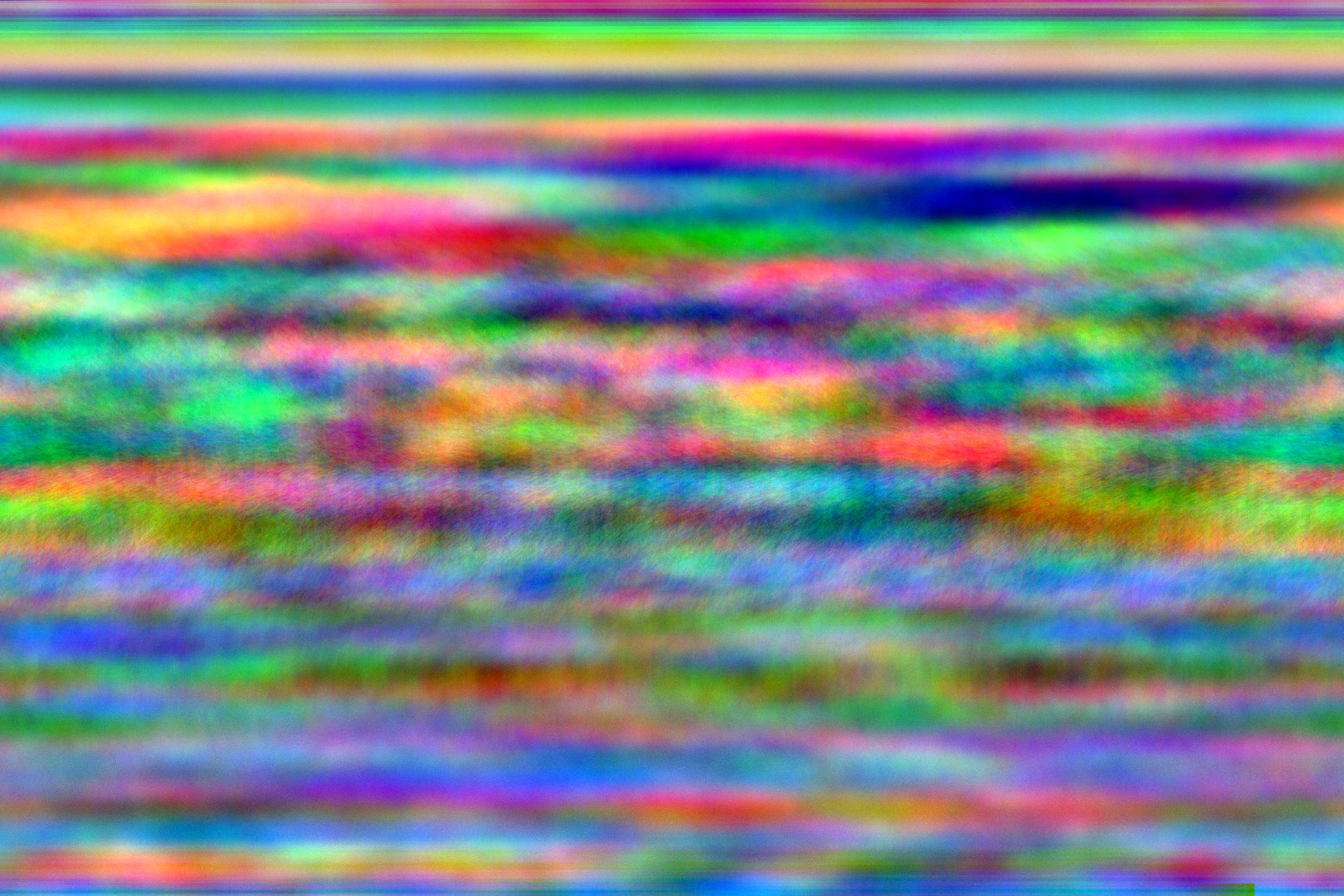 A colorful image. It has multicolored horizontal lines throughout.