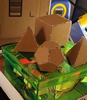 arduino and readers in housing with cardboard polygons on top of readers