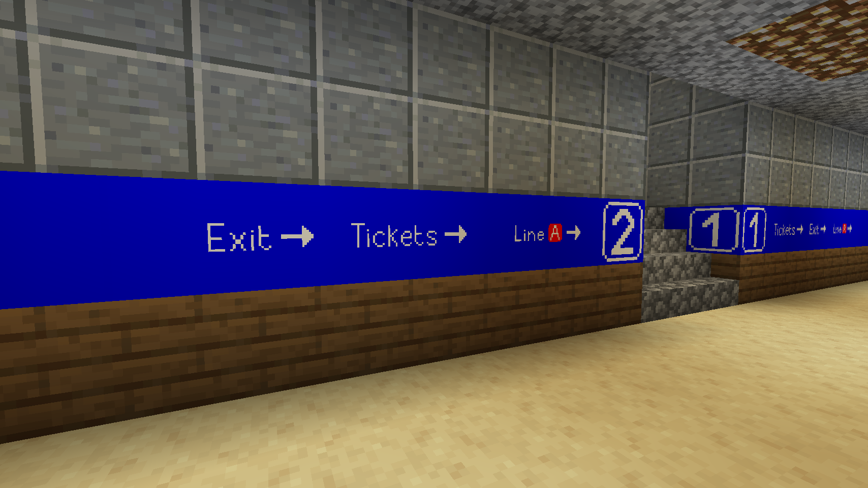 An in-game screenshot inside a railway station underpass, showcasing the signs indicating the platform numbers (1 and 2) and the signs pointing to the exit and the ticket machines.