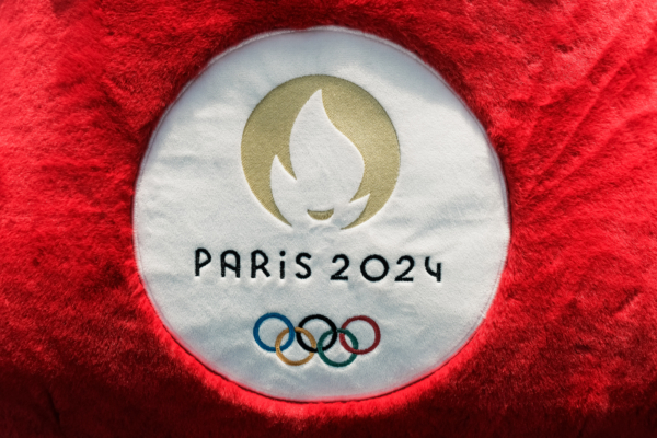 Close-up of the "Paris 2024" logo on the Phryge mascot's stuffed toy as part of 9th stage of the Olympic Torch Relay in Toulouse, southwest of France, May 17, 2024. (Photo by Pat Batard / Hans Lucas / Hans Lucas via AFP) (Photo by PAT BATARD/Hans Lucas/AFP via Getty Images)