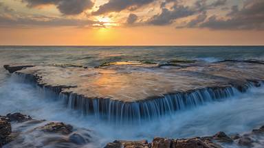 Seawater cascades over an ancient coral reef, Hang Rai, Vietnam (© Thang Tat Nguyen/Getty Images)