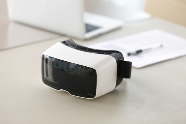 Photo of virtual reality glasses on office table