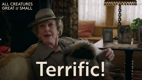 Posh older British lady saying 'excellent!' enthusiastically and clenching a fist