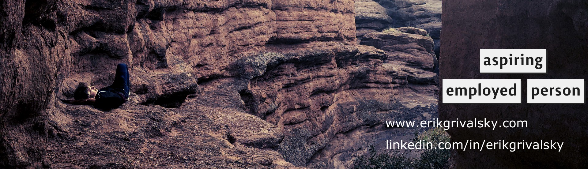 banner photo lying in a canyon