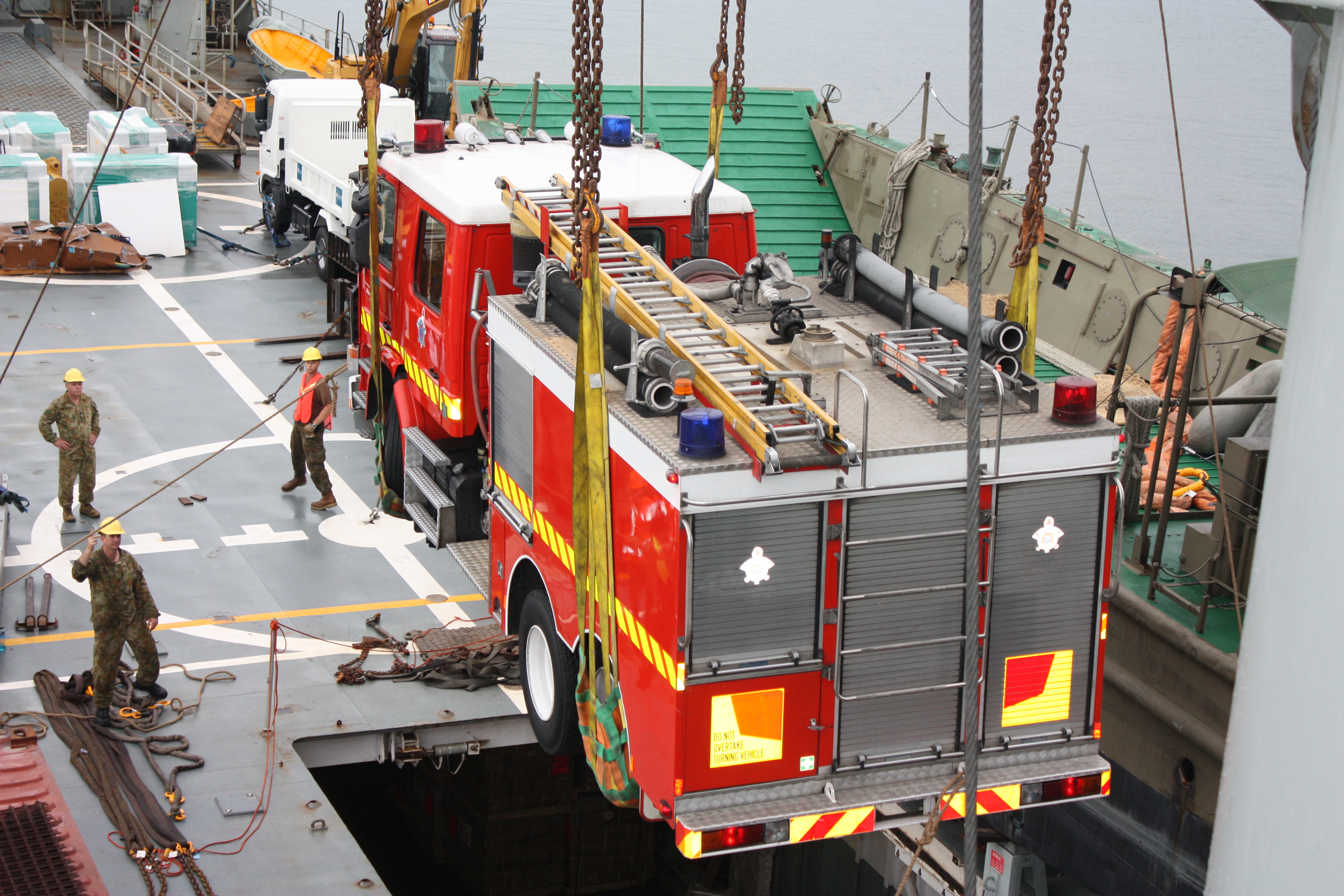 A fire truck being unloaded as part of humanitarian assistance after the 2009 Samoa earthquake and tsunami