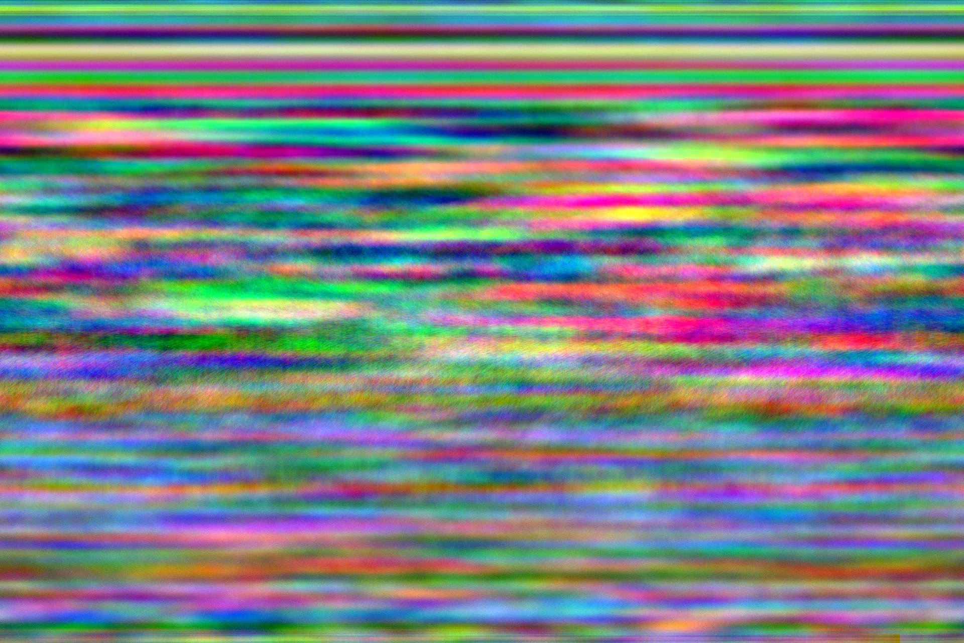 A colorful image. It has fine multicolored horizontal lines throughout.