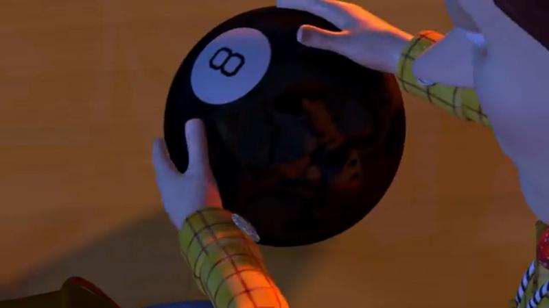 Sheriff Woody reaching down to a Magic 8 Ball