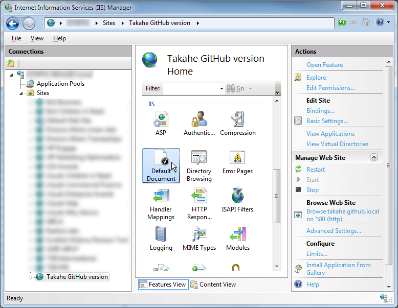 Select your site from the left-hand pane, then in the centre pane, under the IIS heading, click on Default Document